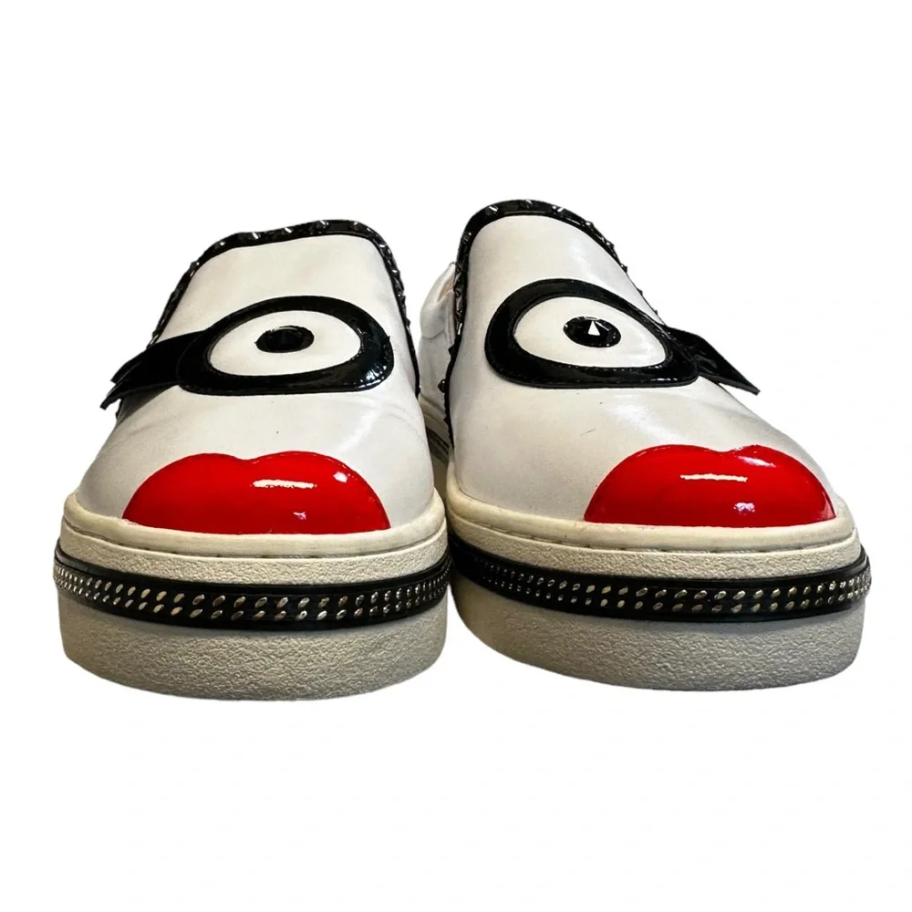 White Leather Slip-On Sneakers with Black Trim and Red Accent